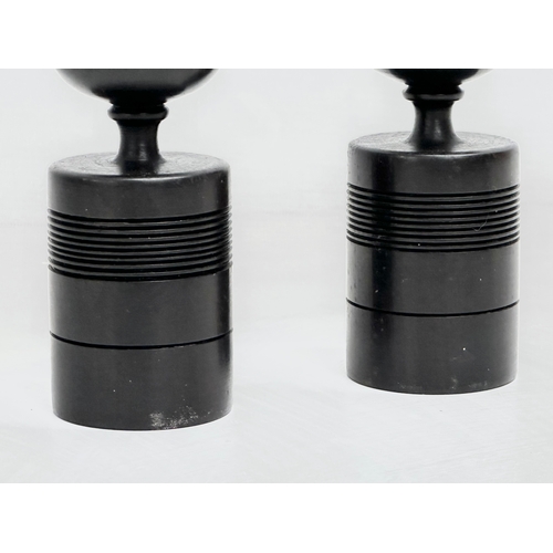 380 - A pair of Early/Mid 20th Century turned ebony candlesticks. 23.5cm