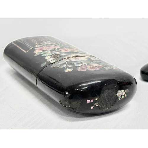 409 - Two Late 19th Century Japanese style lacquered spectacles cases.