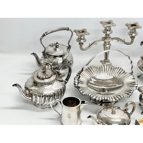 877 - A quantity of silver plate. A 3 piece Walker & Hall tea service, a Walker & Hall naval jug, Victoria... 