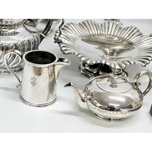 877 - A quantity of silver plate. A 3 piece Walker & Hall tea service, a Walker & Hall naval jug, Victoria... 