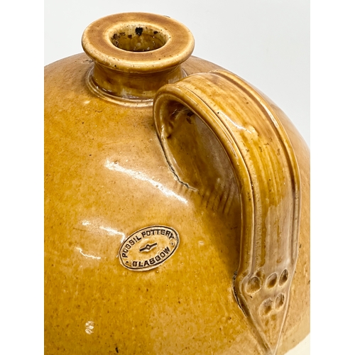 907 - A large Early 20th Century Possil Pottery flagon. 50cm