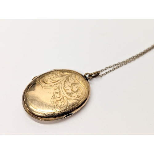 666 - A 9ct gold locket and chain. 4.9g