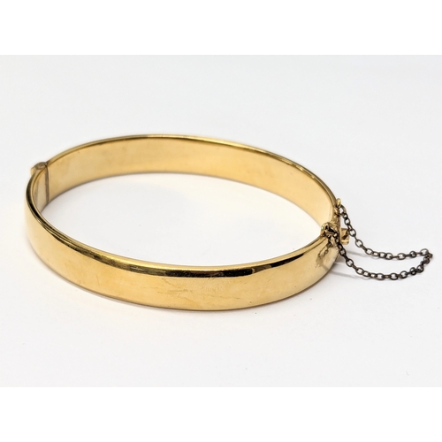 668 - A rolled gold bangle / bracelet.