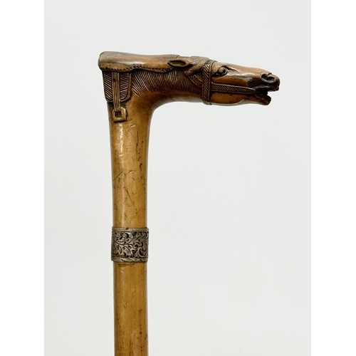 421 - An Early 20th Century silver mounted walking stick. 90cm