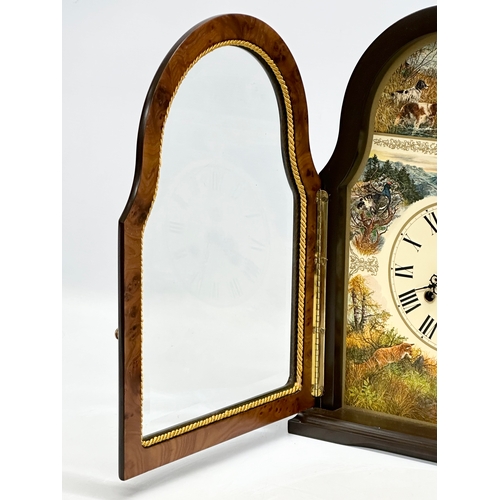 812 - Conrad Franz. A Late 20th Century mantle clock. The Wildlife Clock. 27x11x37cm