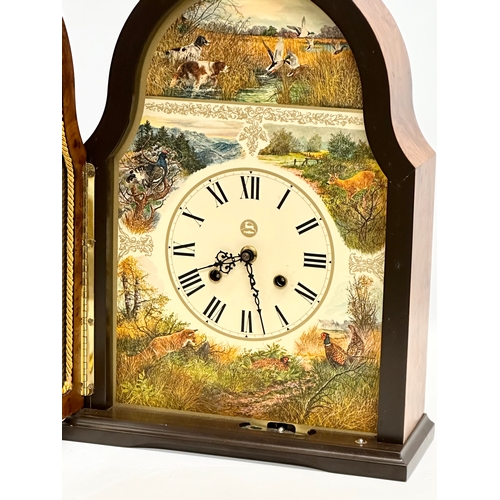 812 - Conrad Franz. A Late 20th Century mantle clock. The Wildlife Clock. 27x11x37cm