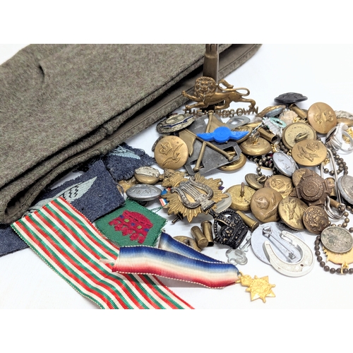 566 - A collection of vintage military badges, predominantly World War II.