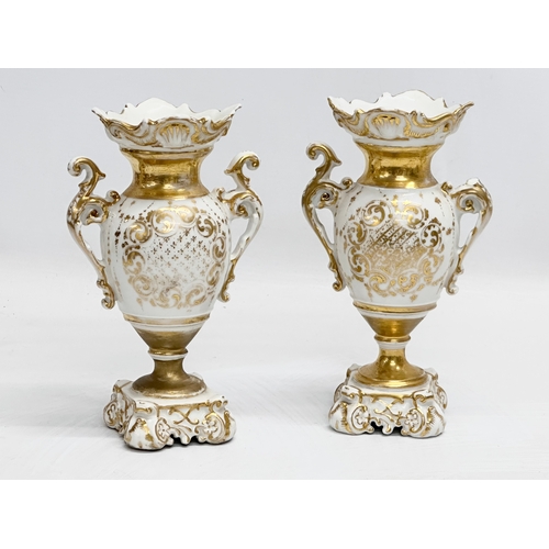 420 - A pair of Early 19th Century hand painted porcelain vases. 19cm