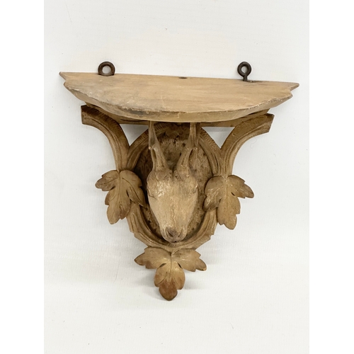 458 - A small Late 19th Century Black Forest carved linden wood stags head wall bracket. 13x13cm