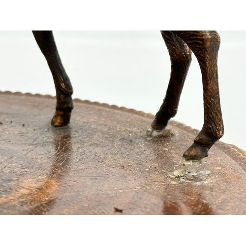 459 - An Early/Mid 20th Century smokers pipe stand with copper stag. 20x17cm