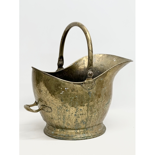 828 - A 19th Century Victorian brass coal scuttle. 28x51cm