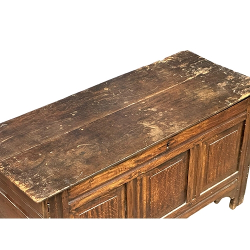 795 - A Late 18th Century, George III oak coffer on stile feet. Circa 1780. 124.5x53x68.5cm