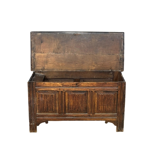 795 - A Late 18th Century, George III oak coffer on stile feet. Circa 1780. 124.5x53x68.5cm