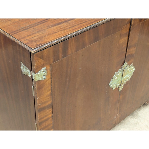 794 - A large Early 20th Century Chippendale Revival mahogany linen cupboard. 126x49x100cm