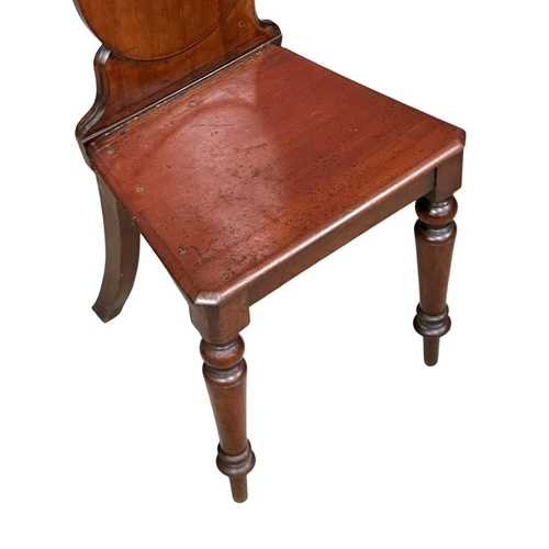 793 - A pair of 19th Century Victorian mahogany shield back hall chairs.