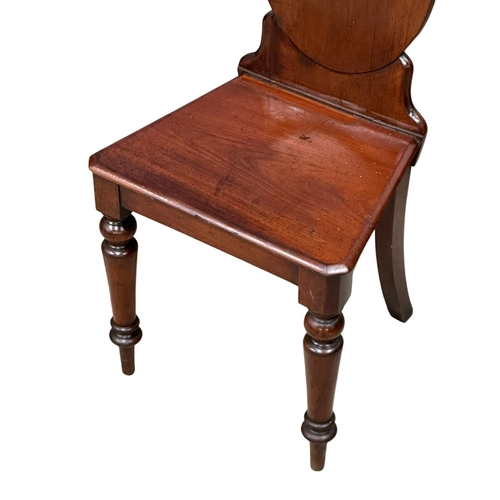 793 - A pair of 19th Century Victorian mahogany shield back hall chairs.