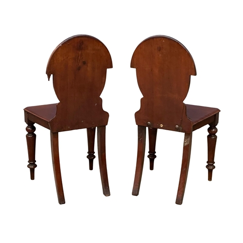 793 - A pair of 19th Century Victorian mahogany shield back hall chairs.