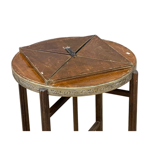 887 - An Early 20th Century brass top folding games table. 60x60x65cm