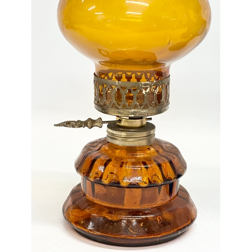 718 - 3 multicoloured glass oil lamps. 35cm. 32cm. 28cm