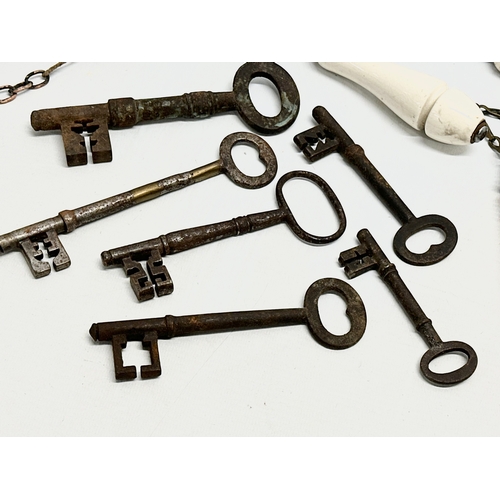 728 - A collection of 19th Century keys and toilet pulls.