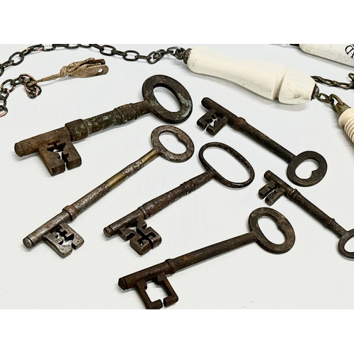 728 - A collection of 19th Century keys and toilet pulls.