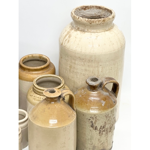 735 - A collection of Early 20th Century stone jars and flagons etc