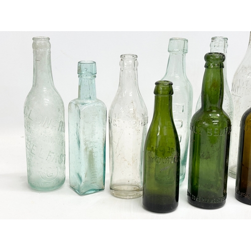 737 - A collection of Irish glass bottles. Clonard, Lyle & Kinahan, Ross’s, Young’s, McKenna & McGinley et... 