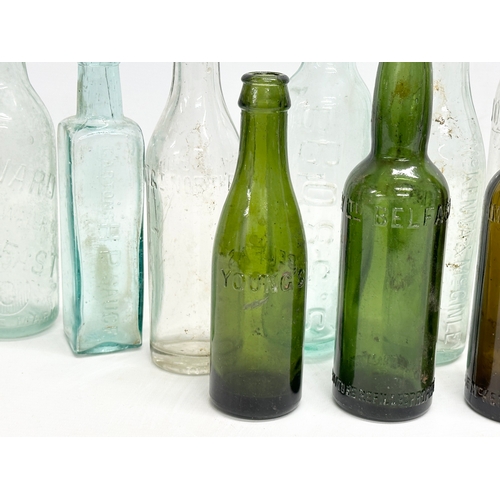 737 - A collection of Irish glass bottles. Clonard, Lyle & Kinahan, Ross’s, Young’s, McKenna & McGinley et... 