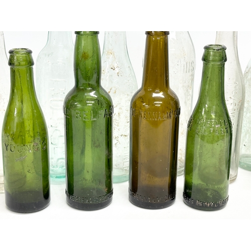 737 - A collection of Irish glass bottles. Clonard, Lyle & Kinahan, Ross’s, Young’s, McKenna & McGinley et... 