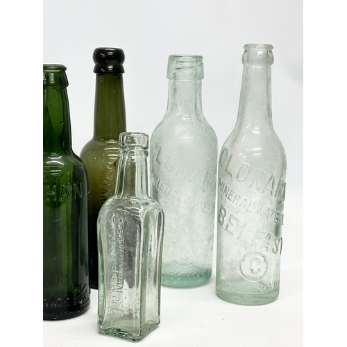 737 - A collection of Irish glass bottles. Clonard, Lyle & Kinahan, Ross’s, Young’s, McKenna & McGinley et... 