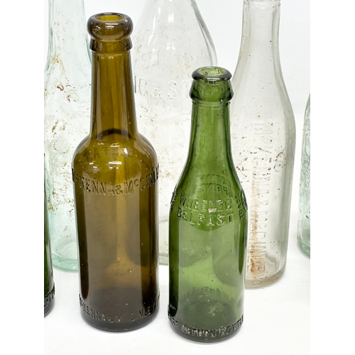 737 - A collection of Irish glass bottles. Clonard, Lyle & Kinahan, Ross’s, Young’s, McKenna & McGinley et... 