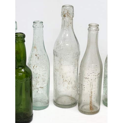 737 - A collection of Irish glass bottles. Clonard, Lyle & Kinahan, Ross’s, Young’s, McKenna & McGinley et... 