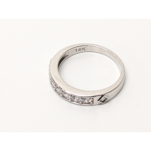 679 - 14ct white gold ring. UK size P. 2.6 grams