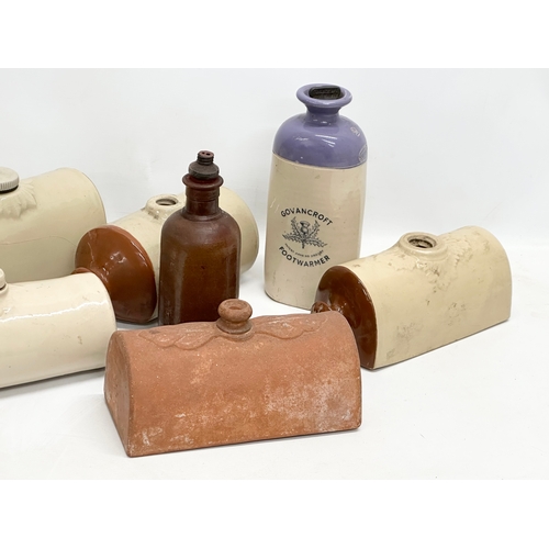 740 - A collection of stoneware hot water bottles etc. including a terracotta butter cover.