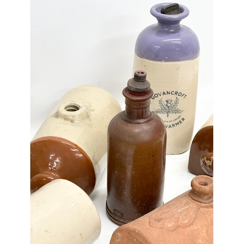 740 - A collection of stoneware hot water bottles etc. including a terracotta butter cover.