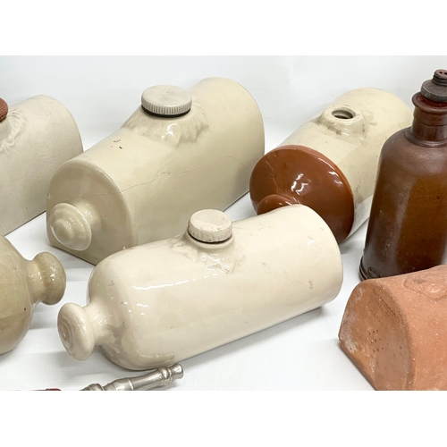 740 - A collection of stoneware hot water bottles etc. including a terracotta butter cover.