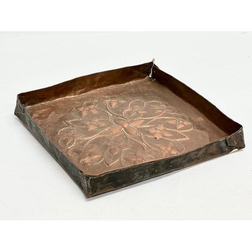 834 - A Late 19th/Early 20th Century Art Nouveau copper tray plaque. 25x25x3cm