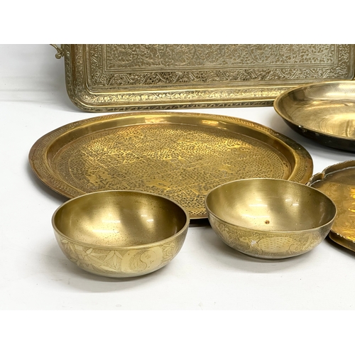 747 - A collection of 19th and Early 20th Century engraved brass trays and bowls.