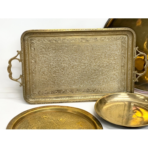 747 - A collection of 19th and Early 20th Century engraved brass trays and bowls.