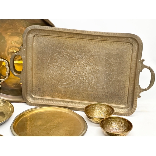 747 - A collection of 19th and Early 20th Century engraved brass trays and bowls.