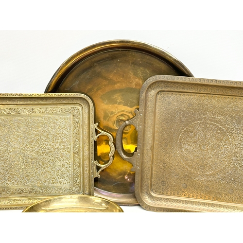 747 - A collection of 19th and Early 20th Century engraved brass trays and bowls.