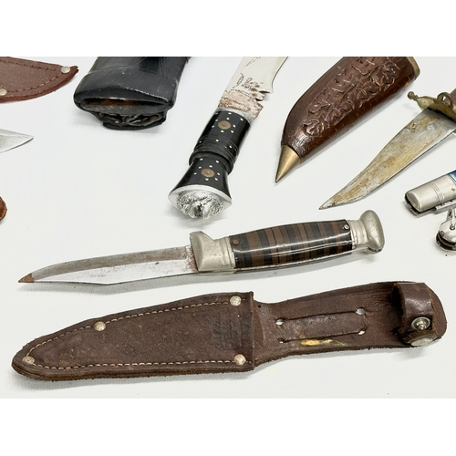 749 - A collection of vintage knives and penknives.