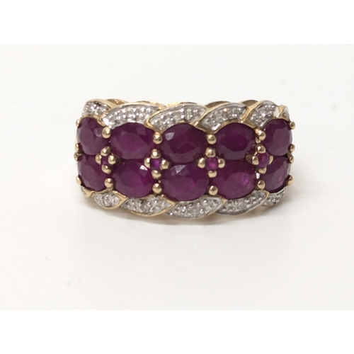 614 - 18ct gold diamond & ruby ring. UK size P. 4.4 grams