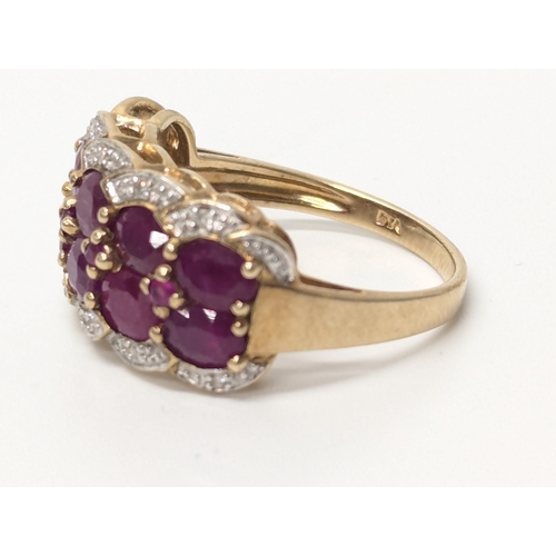 614 - 18ct gold diamond & ruby ring. UK size P. 4.4 grams