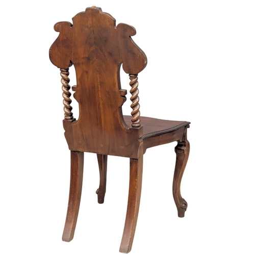 888 - A 19th Century Victorian mahogany shield back hall chair. Circa 1860.