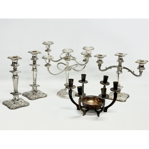 934 - Silver plated candlesticks and candelabras.