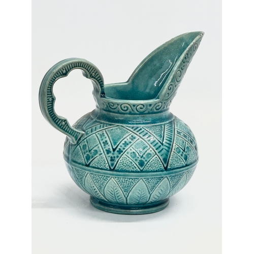 921 - A Mid Century glazed jug. 1930-1950. 18x17cm