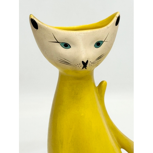 922 - A 1950’s pottery siamese cat vase. 19cm