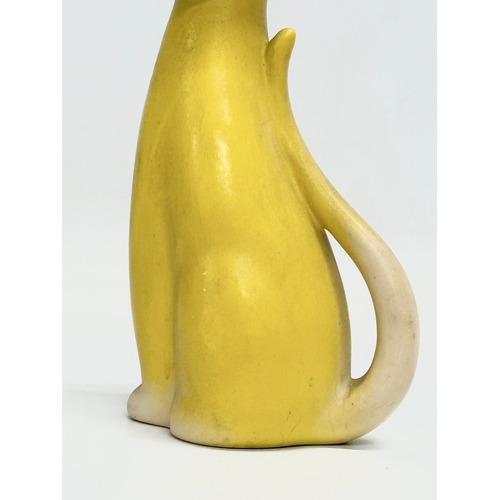 922 - A 1950’s pottery siamese cat vase. 19cm