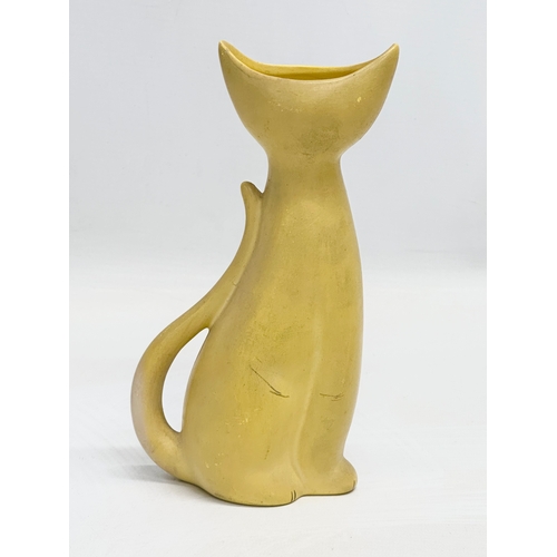 922 - A 1950’s pottery siamese cat vase. 19cm